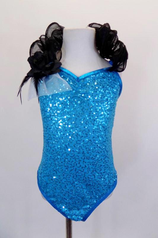 Turquoise sequin leotard has pinch front & halter neck with an attached wide, black curly organza ruffle & adjustable straps. Comes with hair accessory. Front