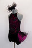 Short unitard has halter neck with a fully sequined body of fuchsia & black sections of stripes & back-cross cross strap design. Comes with black headband. Left Side