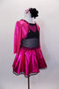 Black leotard has black sheer mesh midriff & black bottom. Has pink glitter skirt &  ¾ sleeved attached jacket style top has pink glitter heart on black bust. Comes with hair accessory. Side