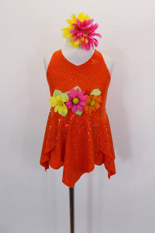 Orange glitter sparkle halter dress had attached nude bottom with separate orange panty. Skirt is a triangular petal cut skirt & front has 3 large flowers. Comes floral hair accessory. Front