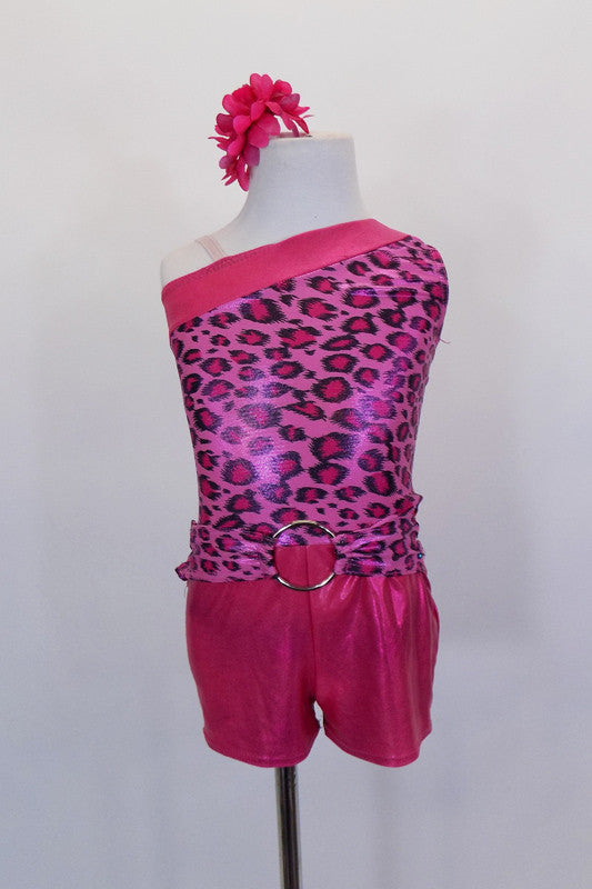 Asymmetrical one shoulder tank short unitard has iridescent pink leopard print & hot pink metallic banding & shorts. Open back & belt have silver ring accents. Front