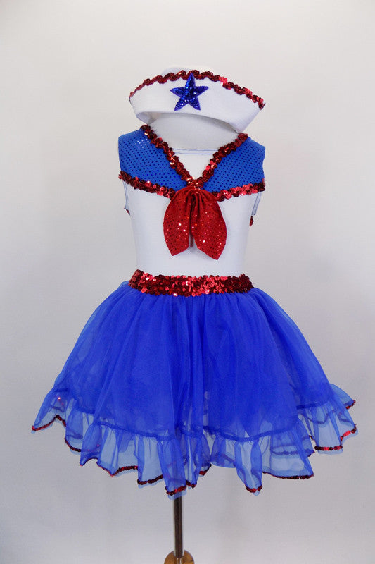 Blue and white leotard dress had white center, blue sparkle collar & shoulders edged with red sequin. The attached skirt is layers of blue tricot with red edge. Comes with sailor hat, red back bow and ruffled socks. Front