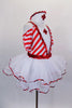 Red & white striped dress has pouf sleeves & white center edged in red sequin with large red cross applique. The attached skirt has petticoat with sequin edge. Comes with nurse hat accessory and ruffled socks. Side