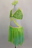 Green sequined halter bra top has yellow-green crystal covered binding. Ring at center links bra by crystaled strap attaching to chiffon flowy skirt. Side