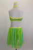 Green sequined halter bra top has yellow-green crystal covered binding. Ring at center links bra by crystaled strap attaching to chiffon flowy skirt. Back