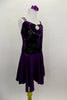 Dark purple velvet pinch front leotard dress has silver swirls on front torso with double cross straps are covered in crystals. Attached skirt is purple chiffon. Side