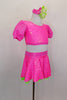 3-piece costume has neon pink bubble print skirt with green ruffled petticoat & attached panty. Tops include a green pleather bra below pouf sleeved half top. Comes with hair  accessory. Side