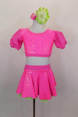 3-piece costume has neon pink bubble print skirt with green ruffled petticoat & attached panty. Tops include a green pleather bra below pouf sleeved half top. Comes with hair  accessory. Front
