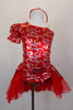 Red pouf sleeved dress has one shoulder & silver lasso designs. There is an open-front bustle skirt with red shiny petticoat & red/silver overlay. Comes with matching headband. Front