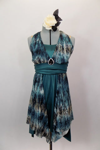 Dark green camisole short unitard is the base of this soft flowy dress. The dark green skirt & waistband are complimented by the halter style print overlay and crystal brooch. Front