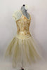 Gold romantic tutu has cream mesh pouf sleeves, cream & gold beaded lace overlay. Long gold & cream crystal tulle skirt has wide waistband with flower detail. Comes with cream floral hair accessory. Right side