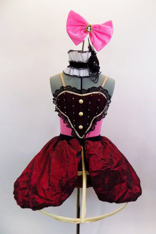 Pink camisole leotard has maroon, pearled bib front panel. Matching maroon, crinkle taffeta skirt is attached to cage crinoline. Has white & black lace choker. Comes with pink hair bow, sateen booties and arm bands. Front 