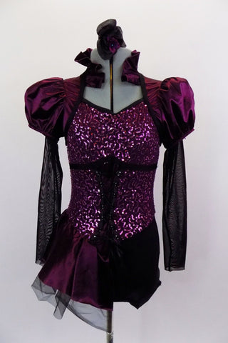 Corset style costume has purple sateen and black mesh pouf sleeves. Neckline is a Queen Anne style with ruffled neck & keyhole back. Has attached side bustle. Front