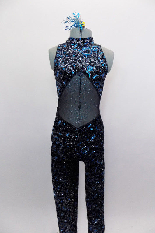 Black velvet based high neck unitard has turquoise and silver glitter swirl design. The back and stomach is glitter mesh & costume zips at back. Comes with matching hair accessory. Front