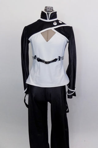 Black & white 2-piece costume has black pants with tie string at bottom & hanging suspenders with silver buttons. Jacket has mandarin collar & silver buttons. Front