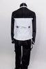 Black & white 2-piece costume has black pants with tie string at bottom & hanging suspenders with silver buttons. Jacket has mandarin collar & silver buttons. Back
