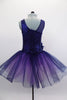 Navy tutu  has asymmetrical sequined bodice. Navy tulle, sits on layers of pale mauve tulle. Wide waistband gathers with a large navy flower on the right hip. Comes with hair accessory. Back