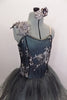 Romantic tutu dress in shades of grey has charcoal crystal tulle over layers of pale grey. The bodice is a charcoal, princess cut styles with embroidered lace. Comes with floral hair accessory. Front zoomed