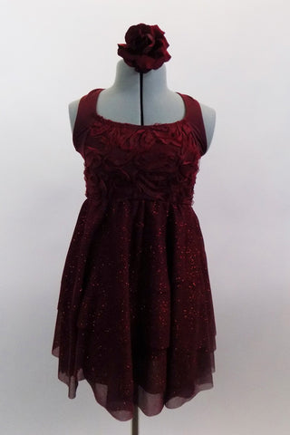Deep maroon glitter mesh halter dress has attached panty. Pretty rose ribbon bodice & angled straps give it a delicate touch. Comes with rose hair accessory. Front