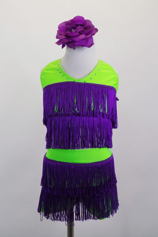 Layers of purple fringe spice up the lime green halter collar and shorts of this sassy two piece costume . Comes with purple floral hair accessory. Front