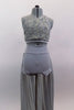 Grey two piece costume has asymmetrical rose ribbon half-top with gold accents. Back straps join below right shoulder blade. High waisted short has long skirt. Front