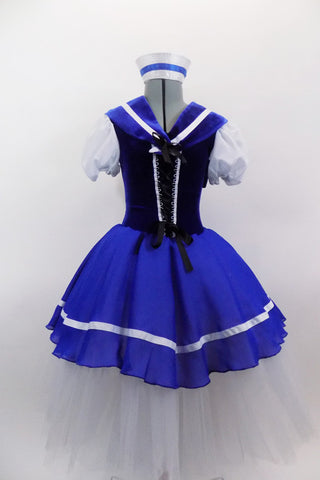 Blue & white sailor themed romantic ballet dress has white pouf sleeves & velvet bodice with lace-up  front. Blue skirt overlay & collar have white ribbon edge over layers of white tulle. Comes with matching sailor hat. Front