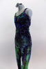 Stretch velvet full unitard with waves of purples greens & blues has silver pattern throughout. Has crystal accents at front & on bow accent of low back. Comes with hair accessory. Side