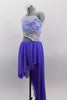 Periwinkle, glitter mesh asymmetrical skirt  is angled short at front & long at back. Skirt is attached to a white, asymmetrical sequined lace top at left hip. Comes with hair accessory. Lefy side