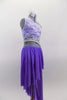 Periwinkle, glitter mesh asymmetrical skirt  is angled short at front & long at back. Skirt is attached to a white, asymmetrical sequined lace top at left hip. Comes with hair accessory. Right side