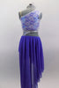Periwinkle, glitter mesh asymmetrical skirt  is angled short at front & long at back. Skirt is attached to a white, asymmetrical sequined lace top at left hip. Comes with hair accessory. Back
