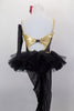 3-piece costume consists of camisole leotard (burgundy & black/gold pinstripes) with low back connected by gold bow band, mesh stirrup tights, a black pull-on tutu, gauntlet and hair bow. Back