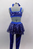 Royal blue unitard has fully sequined bodice with open back, sides & sequin peplum skirt. Has blue bow accent at the of torso & blue legging bottoms. Comes with large hair bow. Back