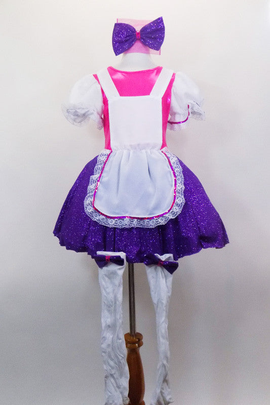 Bright pink bodice with large white pouf sleeves & layered, purple skirt. Has attached white pinafore apron with lace ruffle. Comes with stockings & hair bow. Front