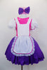 Bright pink bodice with large white pouf sleeves & layered, purple skirt. Has attached white pinafore apron with lace ruffle. Comes with stockings & hair bow. Front zoomed