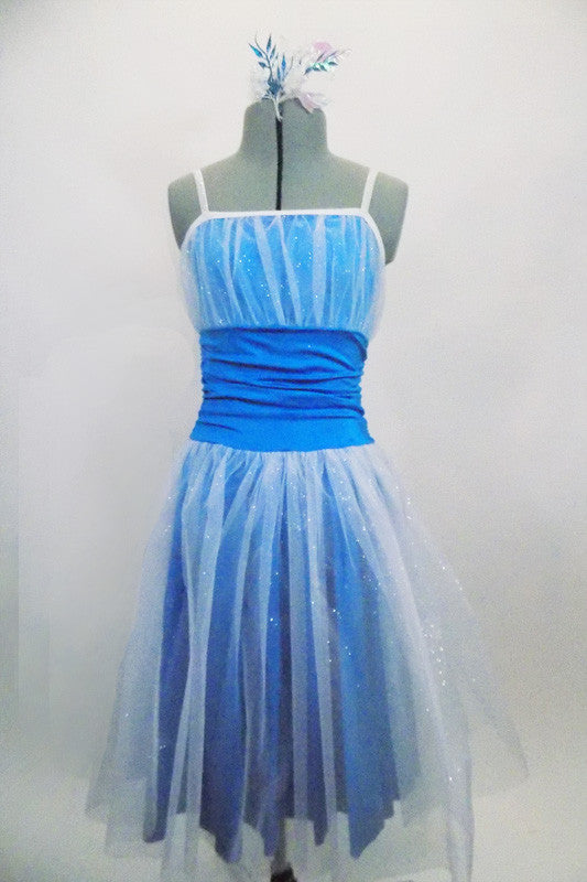 Turquoise dress has white crystal tulle overlay skirt & pleated bust. The wide turquoise waistband is ruched & gathered at sides. Has elastic glitter straps. Front