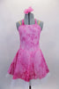 Pink tie-dye glitter stretch dress has tie-up halter collar with crystal ring accent & nude adjustable straps.Dress is lined with white tricot petticoat. Comes with floral hair accessory. Front