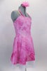Pink tie-dye glitter stretch dress has tie-up halter collar with crystal ring accent & nude adjustable straps.Dress is lined with white tricot petticoat. Comes with floral hair accessory. Side