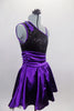 Purple & black asymmetrical dress has black sequined, torso with purple banding & purple sequined applique. Purple satin skirt has cummerbund waist & petticoat. Right side