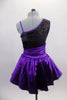 Purple & black asymmetrical dress has black sequined, torso with purple banding & purple sequined applique. Purple satin skirt has cummerbund waist & petticoat. Back