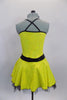 Yellow & black cross over dot-sequin dress has black belt with crystal brooch.  Has back cross straps and black petticoat. Comes with black rose hair accessory. Back