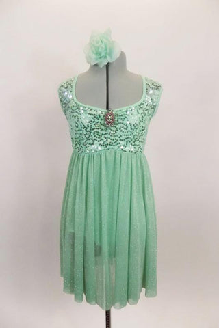 Mint leotard dress has sequined A-line bodice with brooch accent and open back. The skirt is a soft flowing glitter mesh. Comes with matching hair accessory. Front