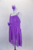 Lavender sequined sheer leotard dress has gathered front bodice with crystal accents Low open back has cross straps. Wide waistband gathers in bow knot at back. Has large flower at waist and matching hair accessory. Side