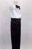 Black & white jumpsuit has white tank style upper with tuxedo shirt front, keyhole back & black bow tie accent. Black sequin pants have cummerbund waistband. Comes with black sequined hat. Right side
