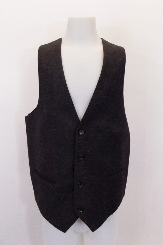Dark grey four-button, “Stockholm Evolution” European-design vest has darted front seams and slit accented pockets. The black satiny back has adjustable waist buckle. Front