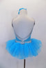 Turquoise velvet leotard has silver swirls with crystal covered silver banding & deep open back. The pull-on tutu has silver waistband & turquoise tulle.  Comes with floral hair accessory. Back