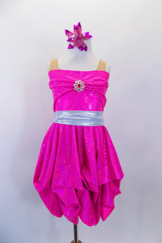 Hot pink sparkle dress has strapless effect through nude mesh straps. Front bust is pinched as is the bottom for bubble effect. Has silver waistband & hair clip. Front