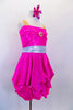 Hot pink sparkle dress has strapless effect through nude mesh straps. Front bust is pinched as is the bottom for bubble effect. Has silver waistband & hair clip. Side