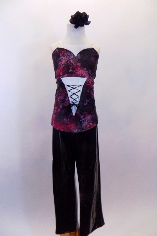 Faux patent leather front pleated pants have front pockets, belt loops & velcro closure. The accompanying top is a smoky black & red crinkle floral stretch. Front
