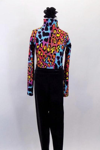 Fully lined high collar long sleeved leotard had keyhole back and thong bottom. The leotard is mix of brightly colored animal prints that comes with shiny black leggings and matching hair accessory. Front