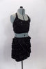 2-piece, costume has sequined black half top with crystals, that accompanies a black ruffle stretch skirt with multiple layers of small ruffles with crystals. Comes with hair accessory. Side